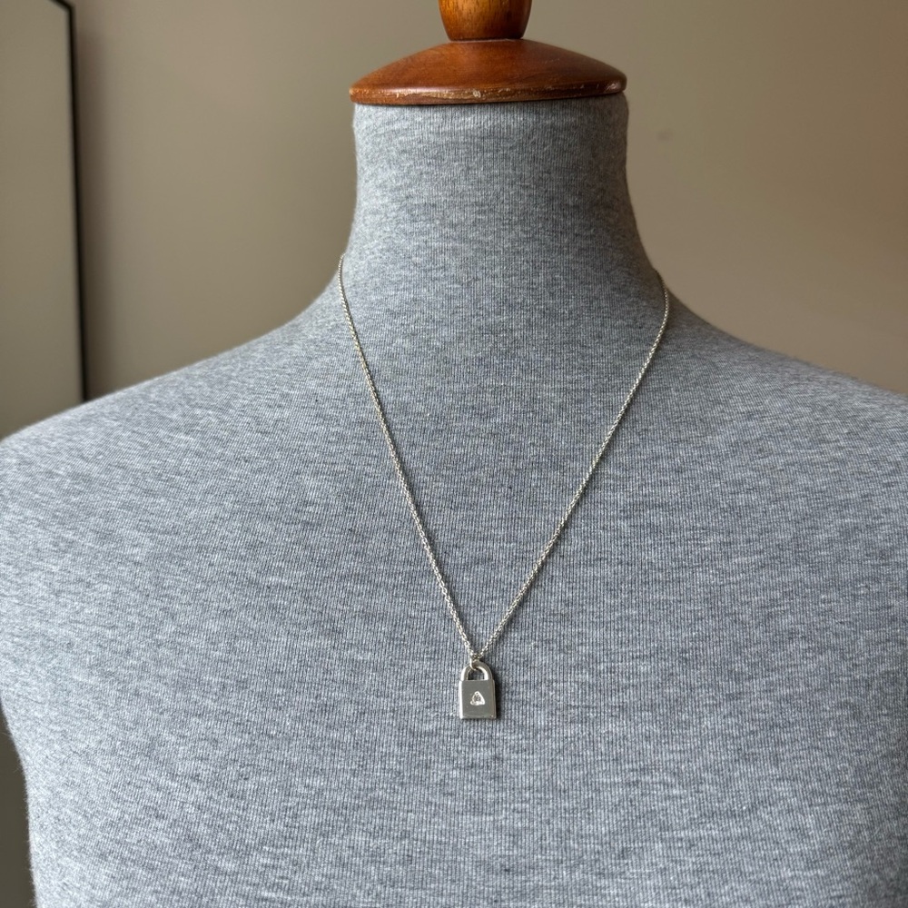 Bryan Anthony’s Silver Lock Pendant Necklace
